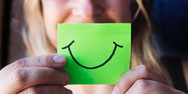 smiling face on a post-it note