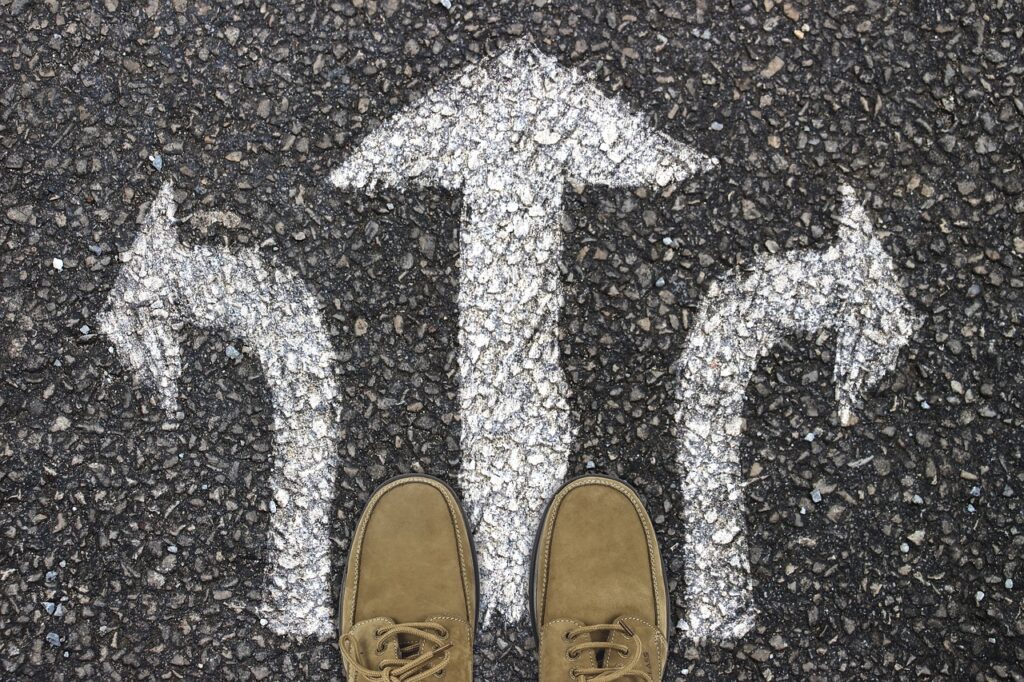 a person stands at a crossroads with three directional options